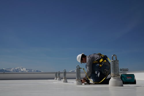 worker attached to a single-point anchor