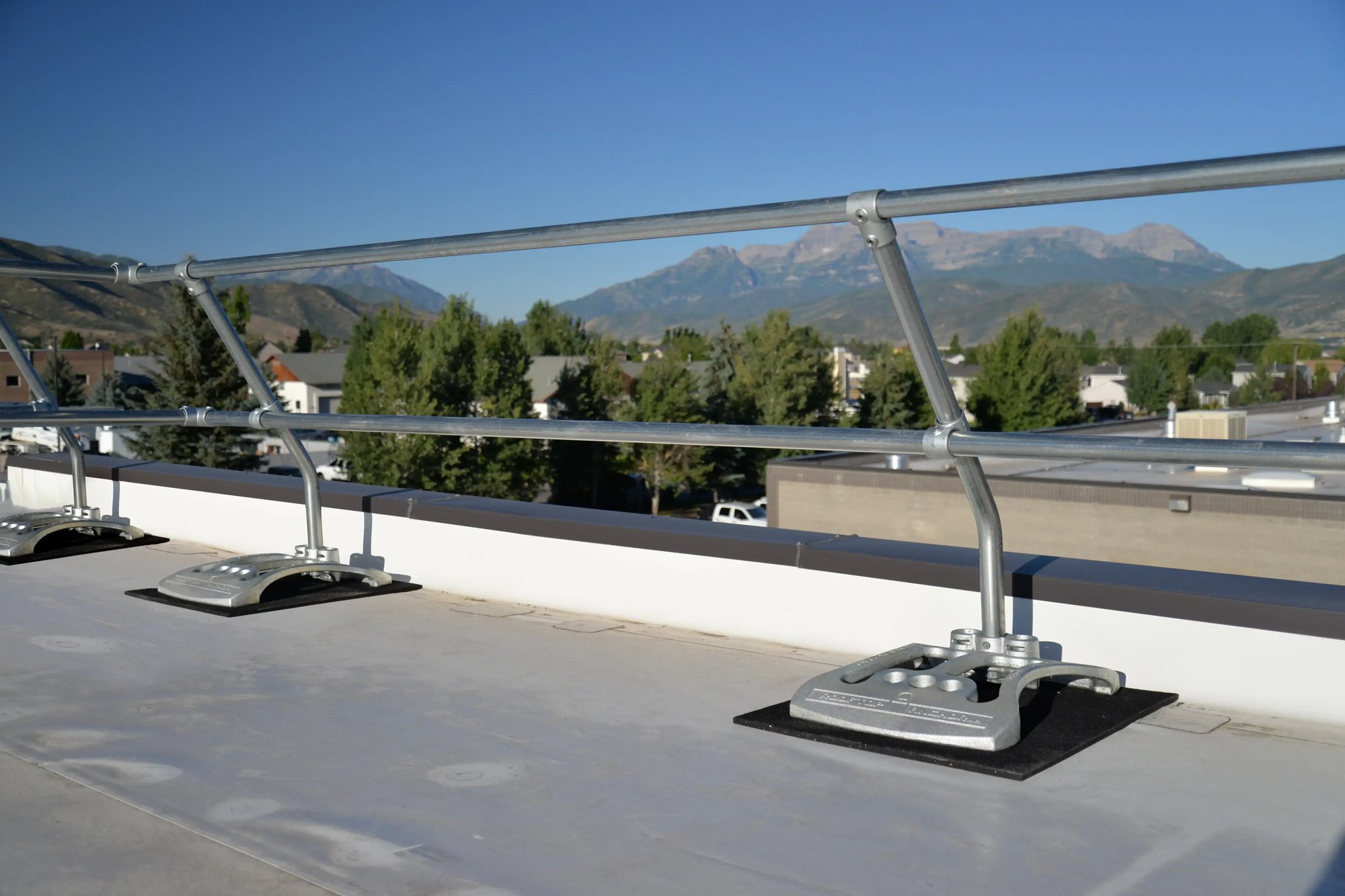 Passive fall protection system rooftop guardrail example