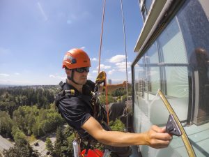 window washer attached to overhead anchor