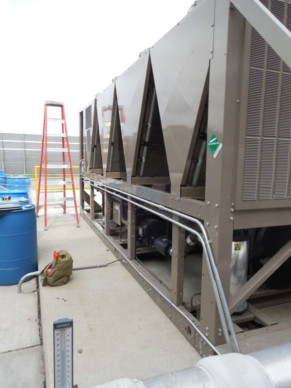 12 foot ladder next to unprotected HVAC unit