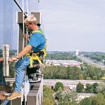 window washing worker on side of building